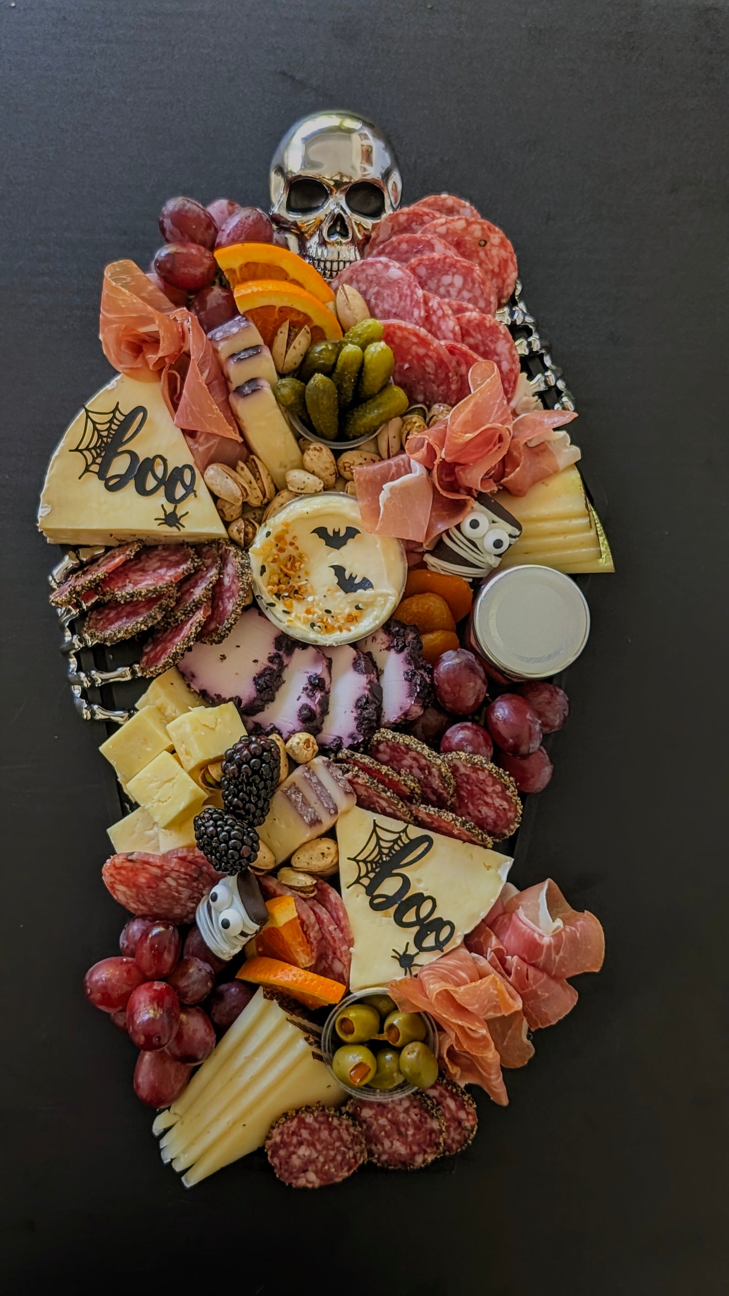 Black and Silver Coffin Skeleton Board with Spooky Halloween Charcuterie 